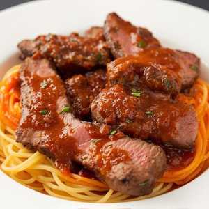 Steak in Black Pepper Sauce over Spaghetti or Rice