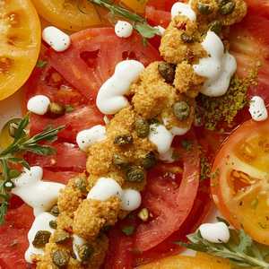 Heirloom and Rosita tomato “carpaccio” with fried capers, horseradish, and tonnato