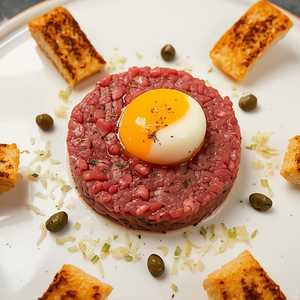 Beef tartare, Dijon mustard, capers, shallots, quail egg, toast points