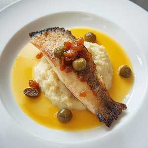 Branzini with Fennel Purée, Saffron-Orange Emulsion, and Caper Raisin Relish