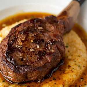 Bone-In Ribeye Steak & Cajun Grits