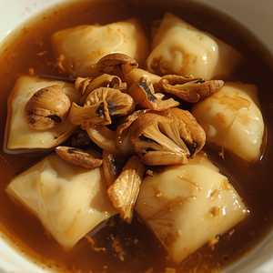Beef Tortelli In Umami Brodo With Chanterelle Mushrooms & Hakurei Turnips