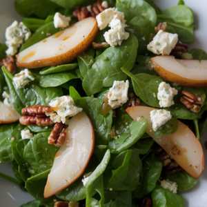 Spinach Salad with Riesling Poached Pears, Gorgonzola, Candied Pecans and Brown Butter Vinaigrette