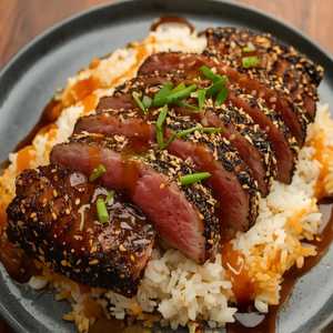 Sushi-Grade Sesame Seared Tuna* with Gingered Rice, White Soy and Sambal Vinaigrette