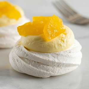 Citrus pavlova with Meyer lemon cream and candied tangelo